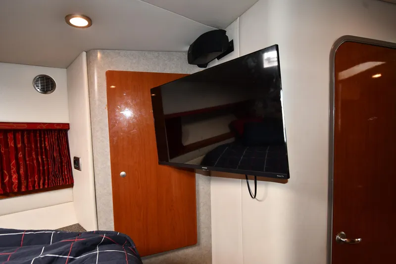  Yacht Photos Pics Interior of 2007 Formula 45 Yacht with mounted TV and wooden cabinetry.