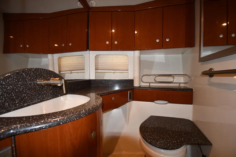  Yacht Photos Pics Luxurious bathroom interior of 2007 Formula 45 Yacht with sleek wood cabinetry and modern fixtures.