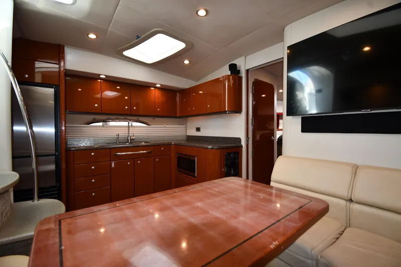  Yacht Photos Pics Luxurious interior of 2007 Formula 45 Yacht with modern kitchen and seating area.