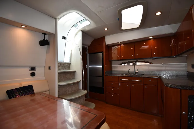  Yacht Photos Pics Interior of 2007 Formula 45 Yacht featuring modern kitchen and elegant wood cabinetry.