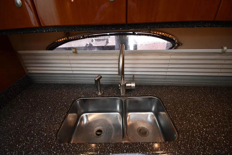  Yacht Photos Pics Stainless steel sink in 2007 Formula 45 Yacht kitchen with modern faucet.
