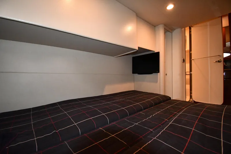  Yacht Photos Pics 2007 Formula 45 Yacht interior cabin with bed, TV, and modern lighting.