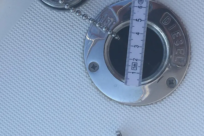  Yacht Photos Pics Diesel fuel cap on 2012 Beneteau Gran Turismo 44 yacht with measuring tape.