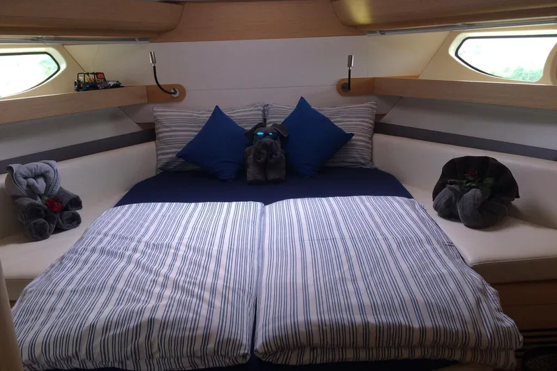  Yacht Photos Pics Luxurious cabin interior of 2012 Beneteau Gran Turismo 44 yacht with elegant bedding.