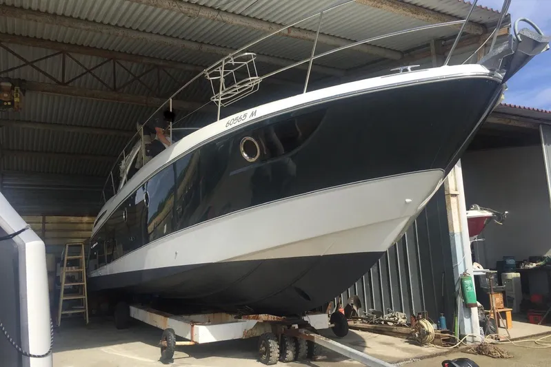  Yacht Photos Pics 2012 Beneteau Gran Turismo 44 yacht in a covered storage area.