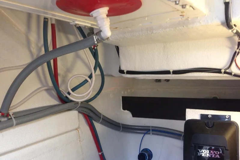  Yacht Photos Pics Engine room of 2012 Beneteau Gran Turismo 44 with Volvo Penta components and various hoses.