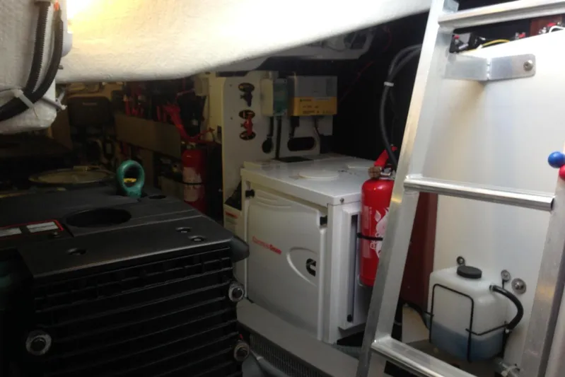  Yacht Photos Pics Engine room of 2012 Beneteau Gran Turismo 44 with equipment and ladder.