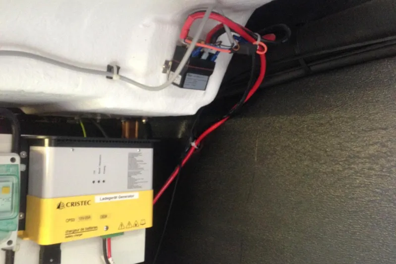  Yacht Photos Pics Electrical system inside a 2012 Beneteau Gran Turismo 44 yacht, featuring a Cristec charger.