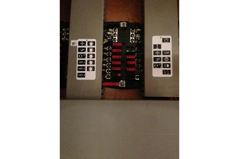  Yacht Photos Pics Electrical panel of a 2012 Beneteau Gran Turismo 44 yacht, showing labeled circuit breakers.
