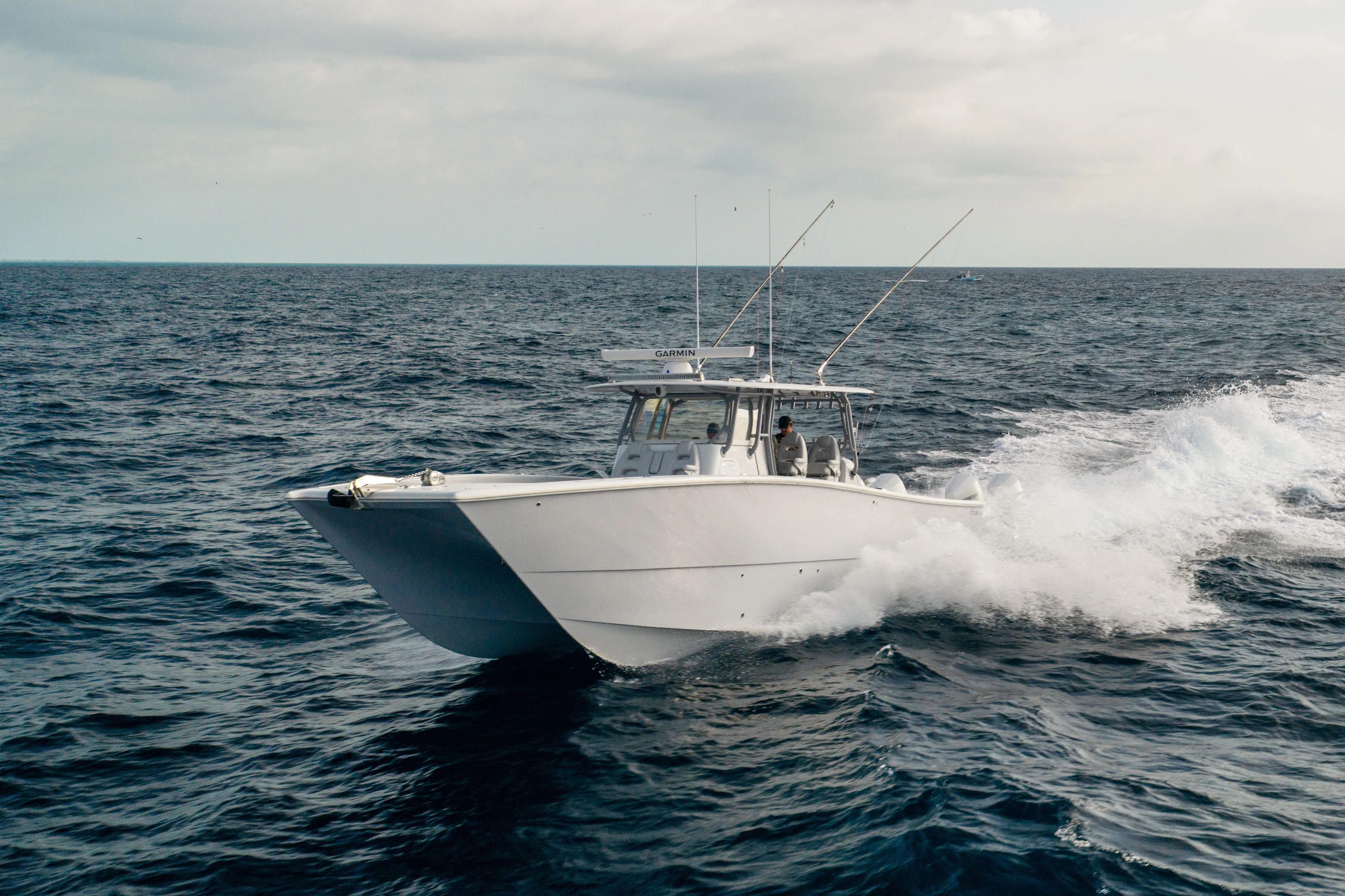  Yacht Photos Pics 2022 Freeman 42LR boat cruising on open ocean waters.