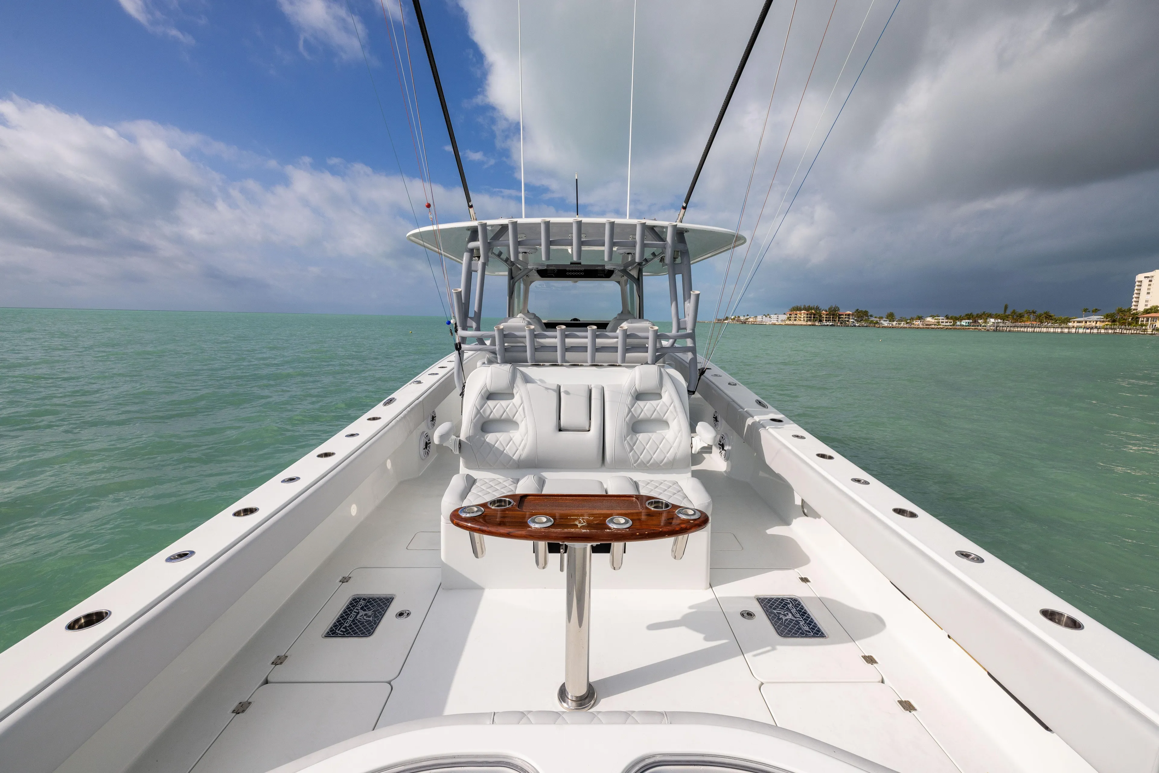  Yacht Photos Pics Freeman 42LR 2022 boat on calm sea with clear sky and coastal view.