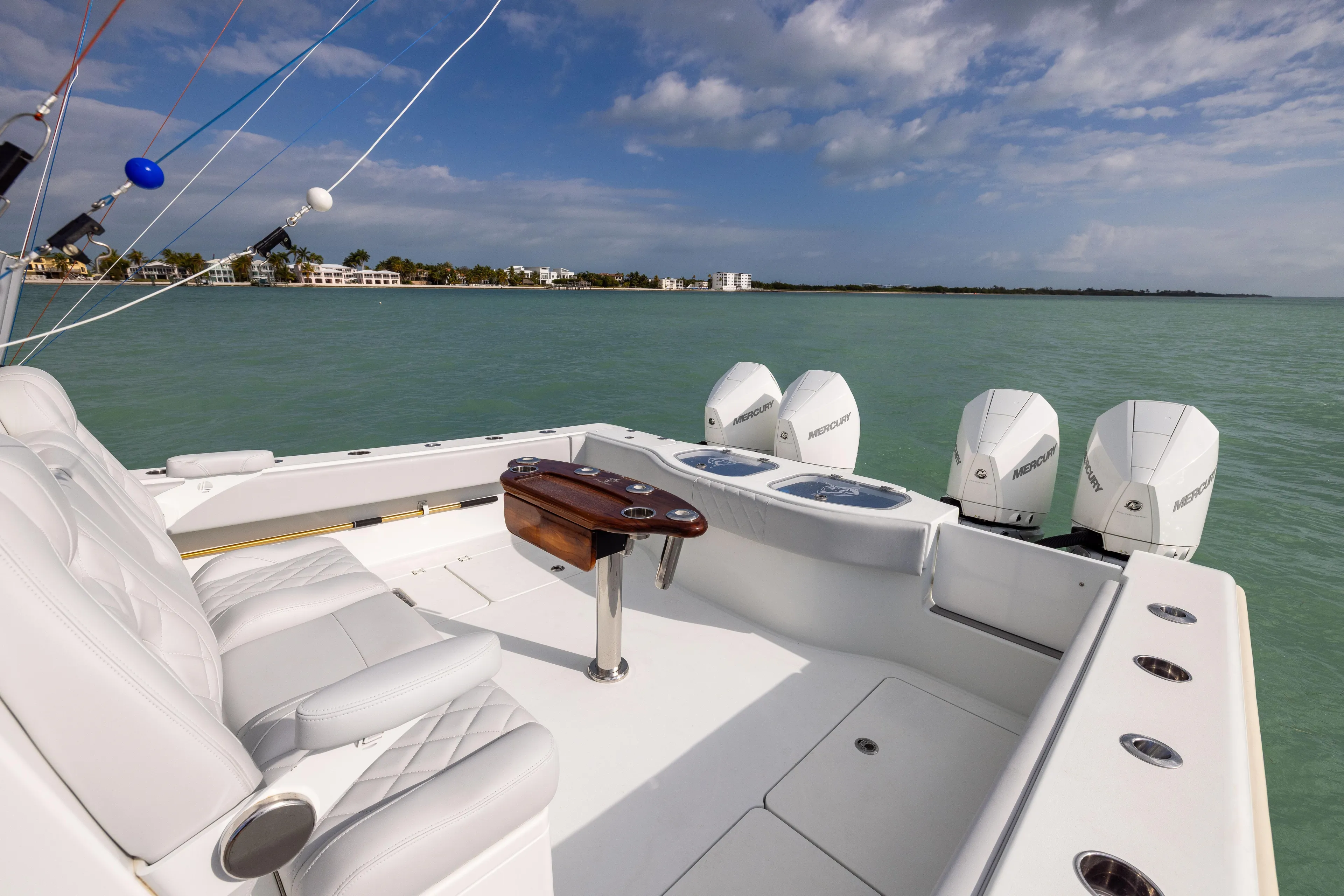  Yacht Photos Pics Luxury Freeman 42LR boat, 2022 model, with four Mercury engines on calm water.