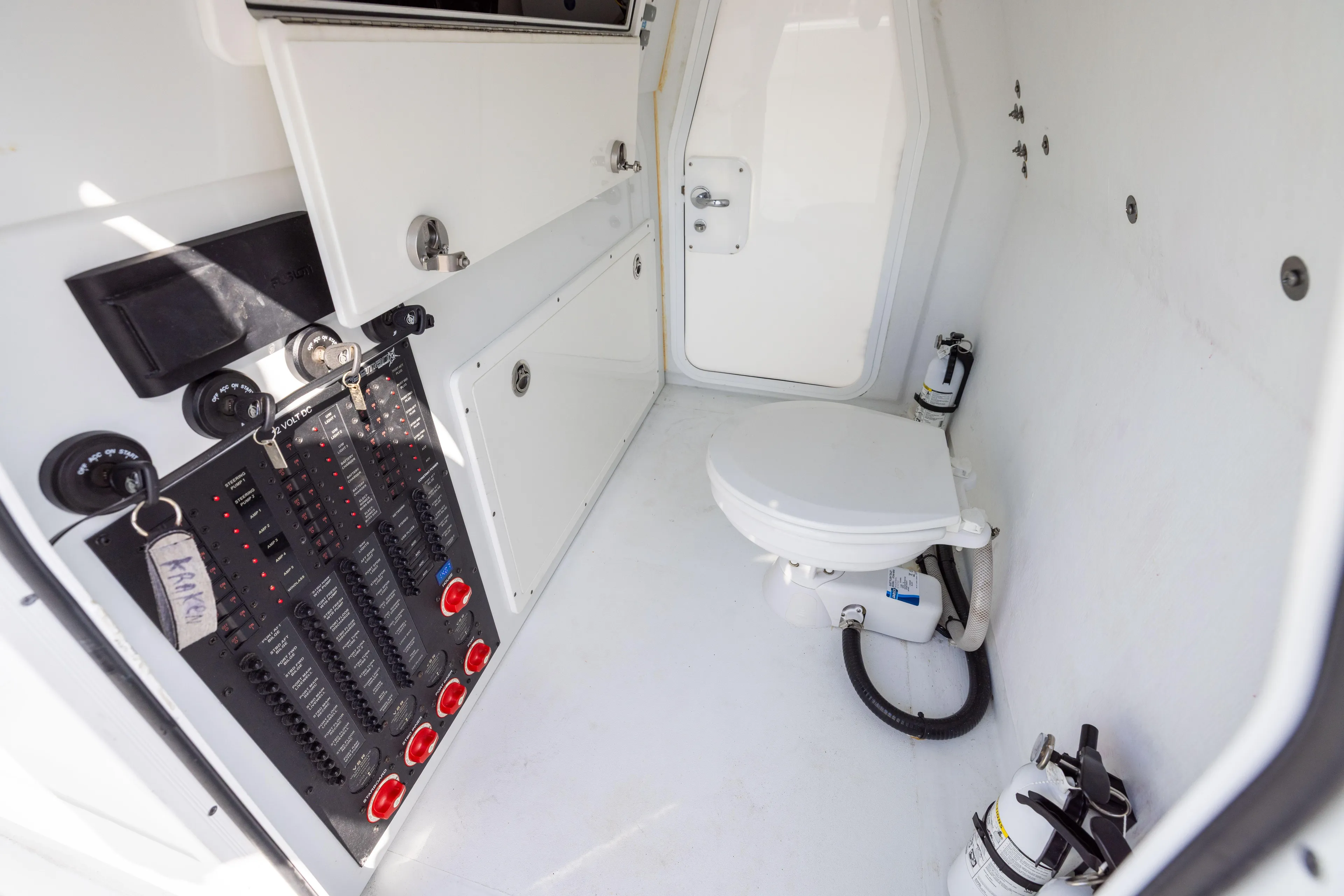  Yacht Photos Pics Interior of a 2022 Freeman 42LR boat featuring a compact bathroom with control panel.