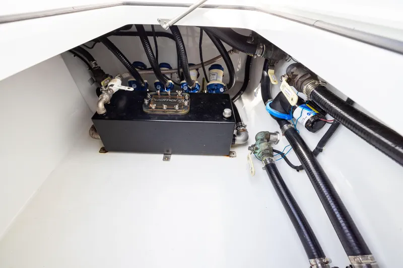  Yacht Photos Pics Engine compartment of 2022 Freeman 42LR boat with hoses and components.