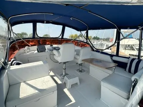 Brass Ring Yacht Photos Pics Interior of 2009 Marine Trader 36 Euro Sedan yacht with seating and helm.
