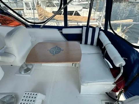 Brass Ring Yacht Photos Pics 2009 Marine Trader 36 Euro Sedan interior with seating and nautical-themed table.