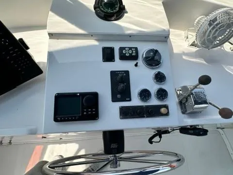 Brass Ring Yacht Photos Pics Control panel of 2009 Marine Trader 36 Euro Sedan with navigation instruments and steering wheel.