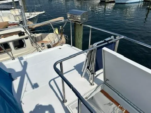 Brass Ring Yacht Photos Pics 2009 Marine Trader 36 Euro Sedan yacht deck with railing, docked at marina.