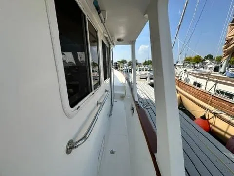 Brass Ring Yacht Photos Pics Side view of 2009 Marine Trader 36 Euro Sedan docked at marina.