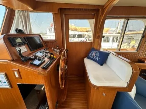 Brass Ring Yacht Photos Pics Interior of 2009 Marine Trader 36 Euro Sedan with helm and seating area.