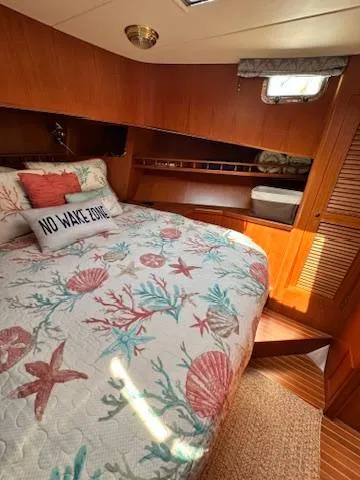 Brass Ring Yacht Photos Pics Cozy cabin interior of 2009 Marine Trader 36 Euro Sedan with nautical bedding.