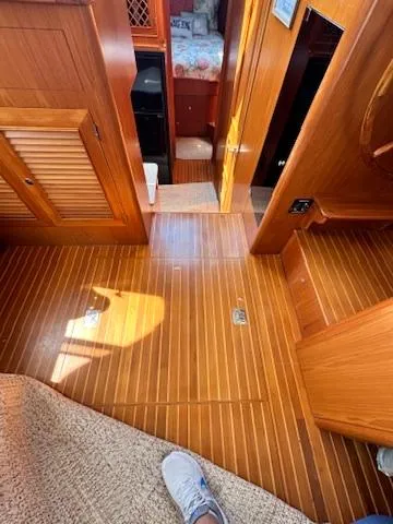 Brass Ring Yacht Photos Pics Interior of 2009 Marine Trader 36 Euro Sedan with wooden flooring and cozy cabin space.