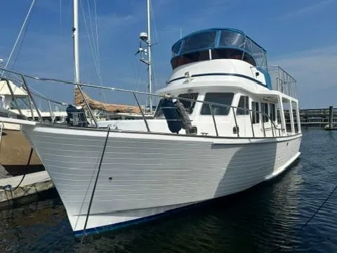 Brass Ring Yacht Photos Pics 2009 Marine Trader 36 Euro Sedan yacht docked in a marina under clear blue skies.