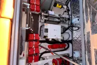 2023 SACS Strider 15 FB engine compartment with red components and mechanical equipment.