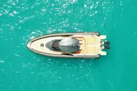 Overhead view of 2023 SACS Strider 15 FB boat on turquoise water.