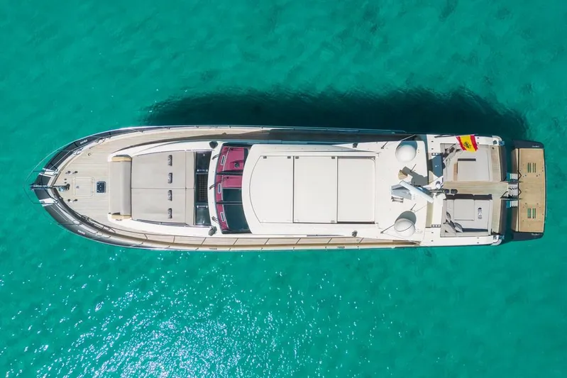 Vintage Yacht Photos Pics Aerial view of 2006 Guy Couach 2100 yacht on turquoise water.