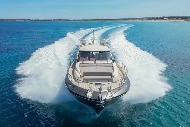 Vintage Yacht Photos Pics Luxury yacht Guy Couach 2100 cruising on clear blue waters, 2006 model.
