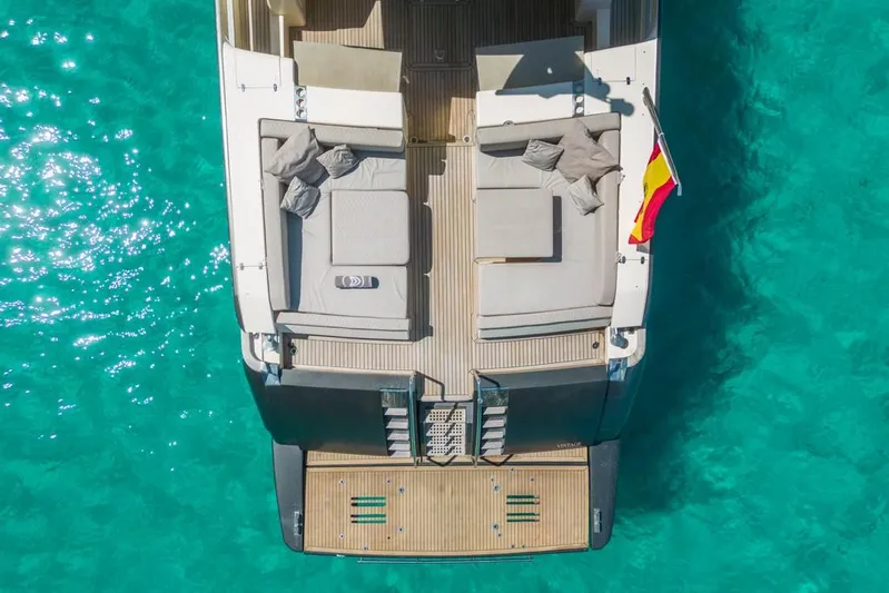 Vintage Yacht Photos Pics Aerial view of 2006 Guy Couach 2100 yacht on turquoise water.