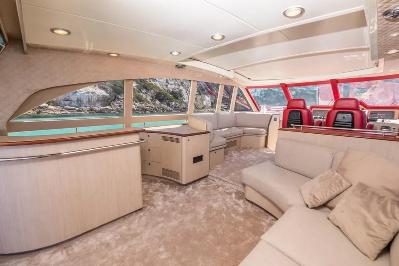 Vintage Yacht Photos Pics Luxurious interior of 2006 Guy Couach 2100 yacht with plush seating and scenic windows.