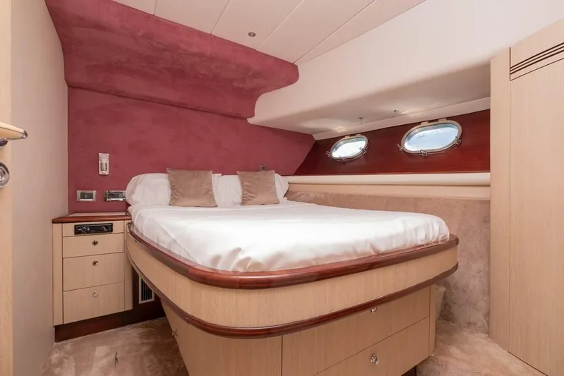 Vintage Yacht Photos Pics Luxurious bedroom interior of 2006 Guy Couach 2100 yacht with elegant wood finish.