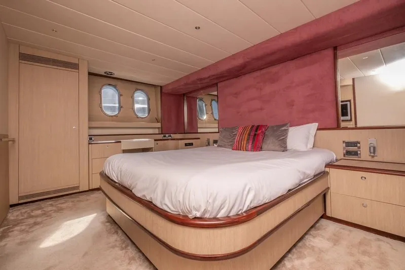 Vintage Yacht Photos Pics Luxurious bedroom interior of 2006 Guy Couach 2100 yacht with elegant furnishings.