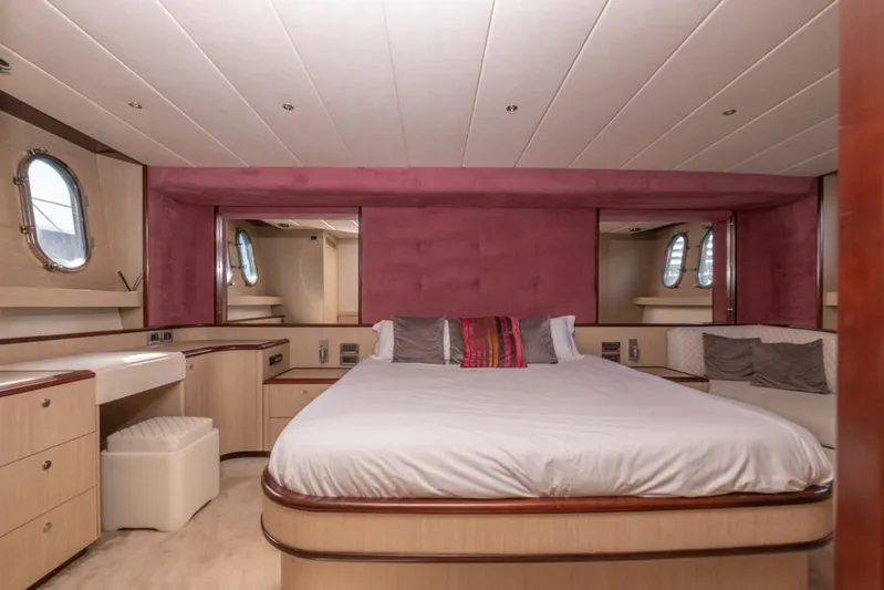 Vintage Yacht Photos Pics Luxurious bedroom interior of 2006 Guy Couach 2100 yacht with elegant furnishings.