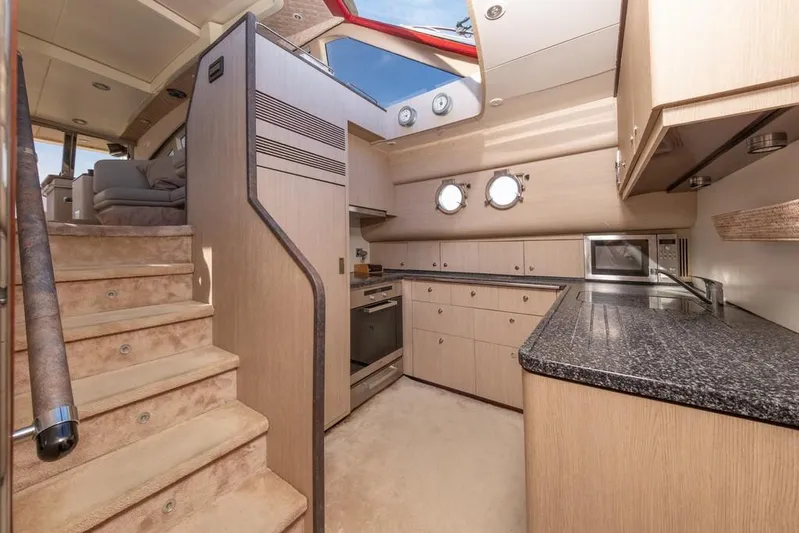 Vintage Yacht Photos Pics Luxurious kitchen interior of 2006 Guy Couach 2100 yacht with modern amenities.