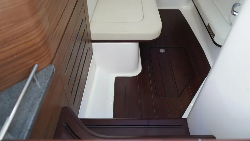 Yacht Kings Yacht Photos Pics 2020 Boston Whaler 350 Realm interior with wood accents and cushioned seating.