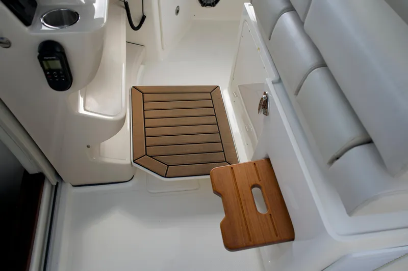 Yacht Kings Yacht Photos Pics Interior of 2020 Boston Whaler 350 Realm, featuring seating and wooden step detail.