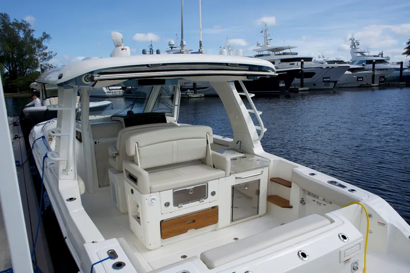 Yacht Kings Yacht Photos Pics 2020 Boston Whaler 350 Realm boat docked, featuring spacious seating and modern amenities.