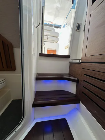 Yacht Kings Yacht Photos Pics Interior stairs of 2020 Boston Whaler 350 Realm with blue LED lighting.