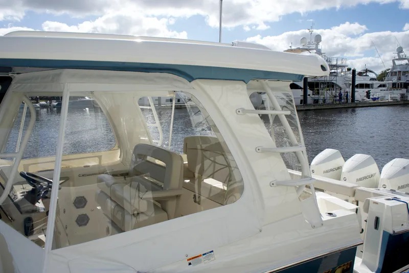 Yacht Kings Yacht Photos Pics 2020 Boston Whaler 350 Realm boat docked, showcasing interior seating and exterior design.