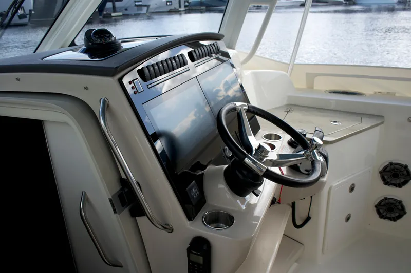 Yacht Kings Yacht Photos Pics 2020 Boston Whaler 350 Realm helm with modern controls and steering wheel.
