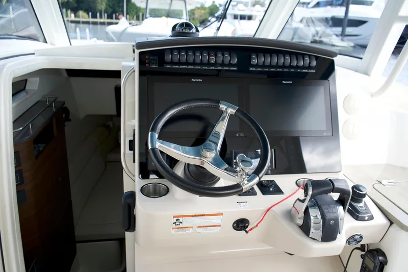 Yacht Kings Yacht Photos Pics 2020 Boston Whaler 350 Realm helm with dual screens and modern controls.