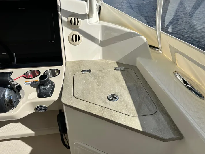 Yacht Kings Yacht Photos Pics 2020 Boston Whaler 350 Realm helm station with control panel and storage compartment.