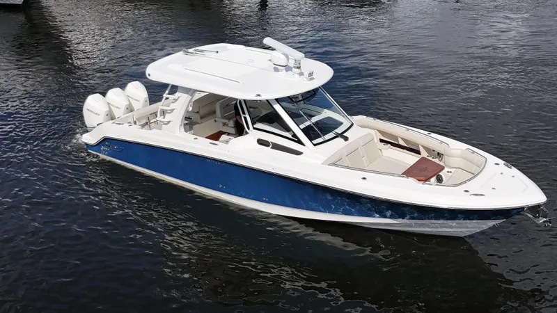 Yacht Kings Yacht Photos Pics 2020 Boston Whaler 350 Realm boat on water, featuring sleek design and triple engines.
