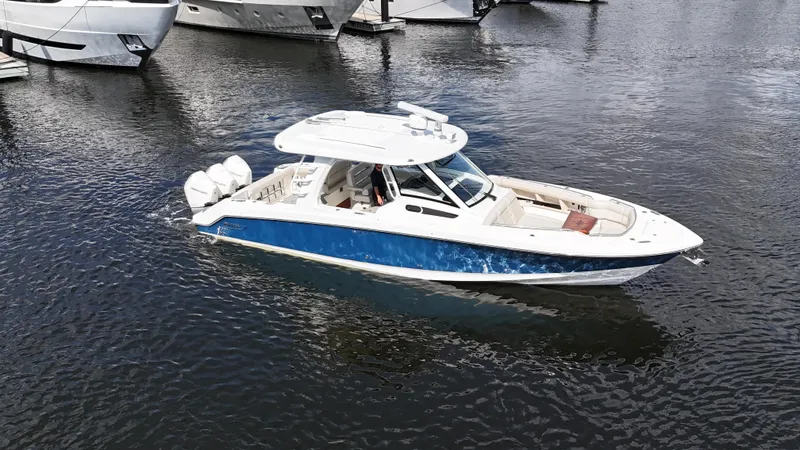 Yacht Kings Yacht Photos Pics 2020 Boston Whaler 350 Realm boat on water, featuring sleek design and powerful engines.