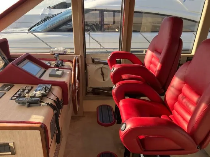 Vintage Yacht Photos Pics Red leather seats in the helm of a 2006 Guy Couach 2100 yacht.