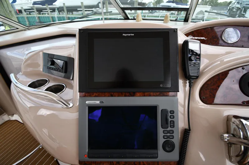  Yacht Photos Pics Control panel of 2003 Sea Ray 460 Sundancer yacht with navigation screens and radio.