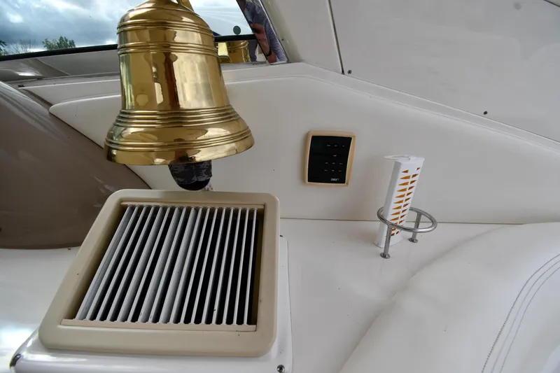  Yacht Photos Pics 2003 Sea Ray 460 Sundancer interior with brass bell and ventilation grille.